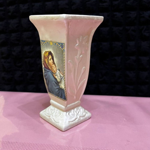 Decorative ceramic candle holder used with Virgin Mary and Christ