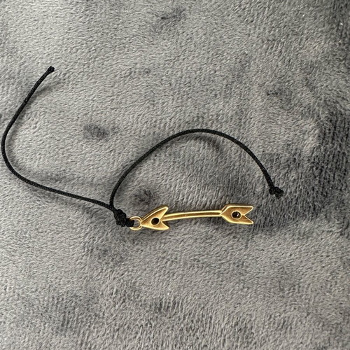 Arrow pendant necklace used with black cord and gold detail