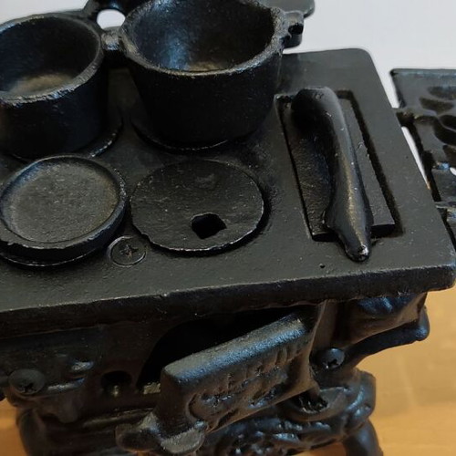 Miniature wooden stove with cast iron accessories like new
