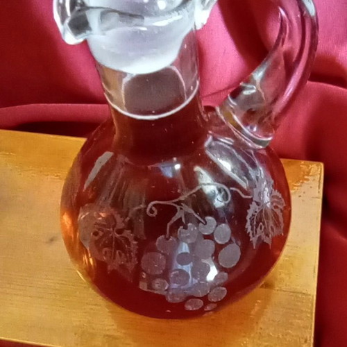 Handmade oil and vinegar set with carved glass bottles and wooden base