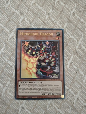 Mimighoul Dragon Yu-Gi-Oh! card in excellent condition