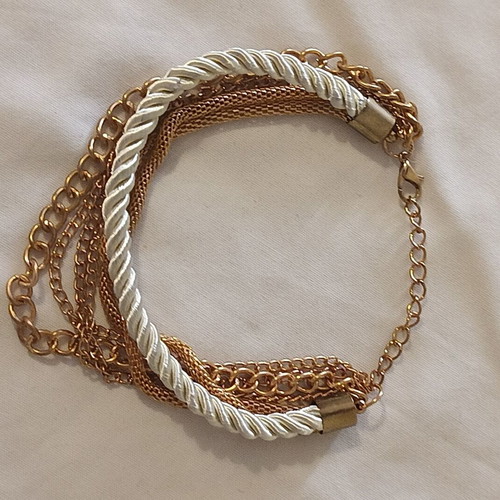 Women's bracelet with cream cord and gold chains, new