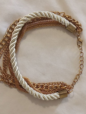 Women's bracelet with cream cord and gold chains, new