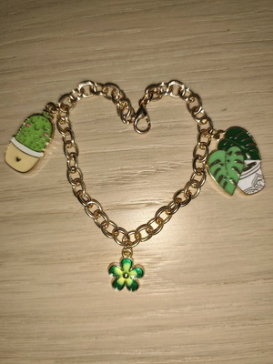 Bracelet new with green shades and gold details