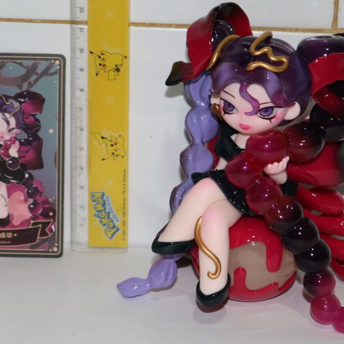 Anime cherry figure toy girl with long purple hair on cake cherry