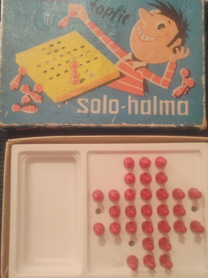 Solo-Halma vintage board game with three jumps on pegs