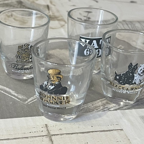 Whiskey Shot Glasses set of 4 like new, collectible labels