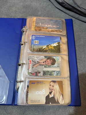 Album with 50 various phone cards like new
