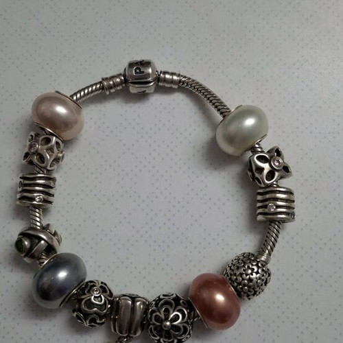 Pandora silver bracelet new with 13 charms