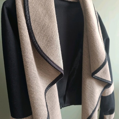 Short women's coat with a waterfall collar
