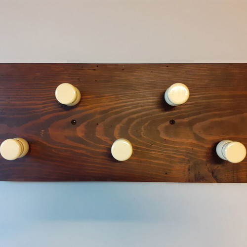 Wooden wall hanger with handles from old barber shaving brushes
