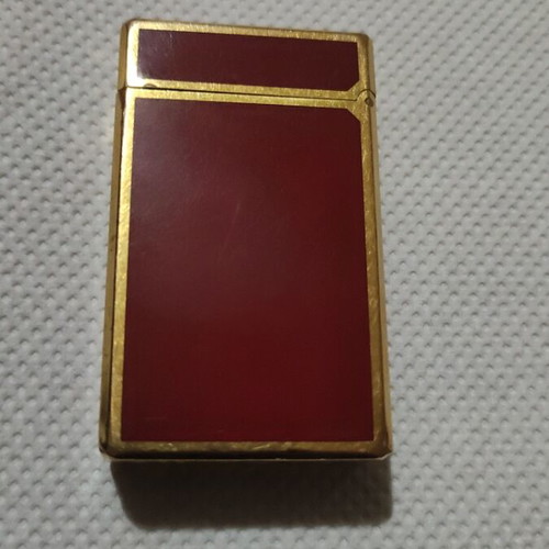 S.T.Dupont lighter like new, gold and red, refillable gas