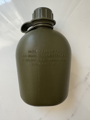 Military-style khaki water canteen with cap