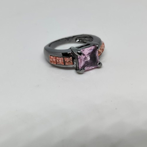 Ring with purple central crystal and pink details in black metal like new