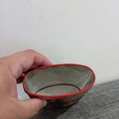 Vintage metal pencil holder decorated with icons used