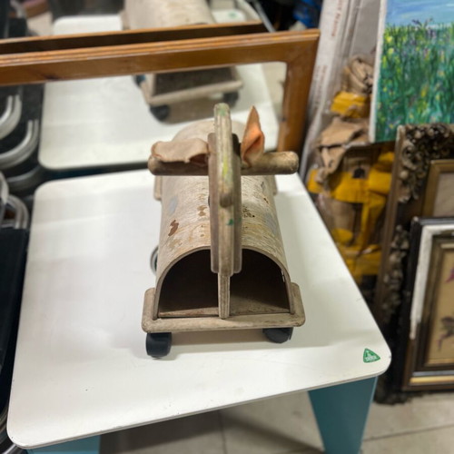 Wooden children's horse toy used with wear