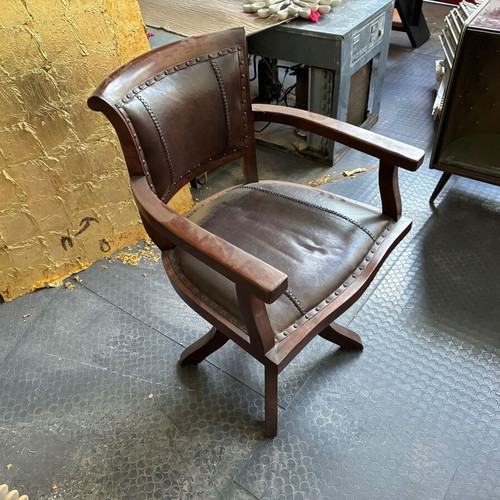 Wooden swivel office chair with leather upholstery