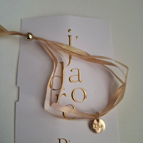 Dior bracelet with charm and adjustable ribbon new, gold and beige