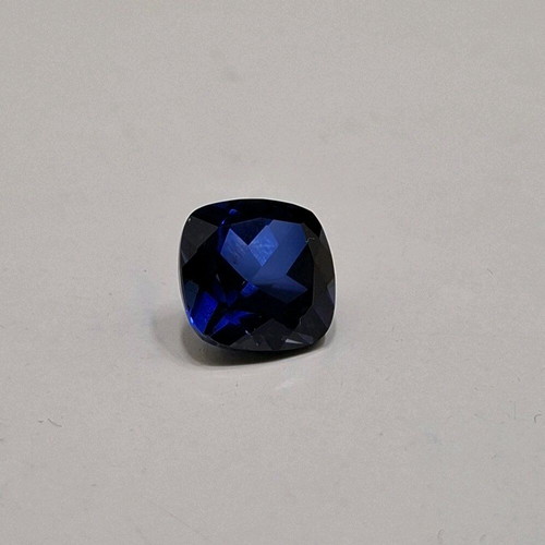 Artificial sapphire like new, dark blue, approx. 1cm x 1cm