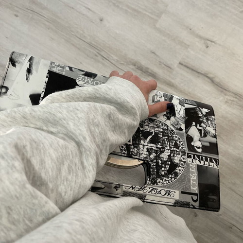 Vintage newspaper print clutch bag with metal handle, black and white