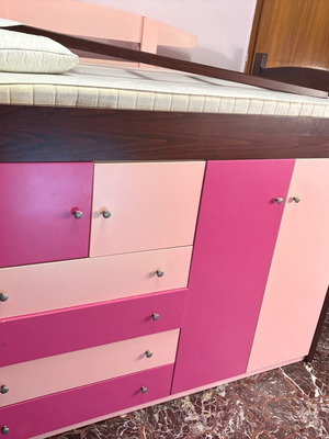 Loft bed used with storage cabinets and hidden desk