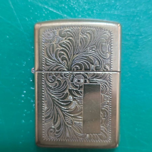 Vintage ZIPPO lighter in gold color, Venetian filigree design