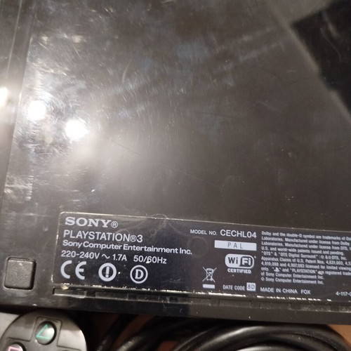 PlayStation 3 console used with controller, charging cable and 6 games