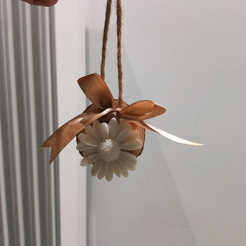 Handmade aromatic closet piece with natural wood trunk and white daisy
