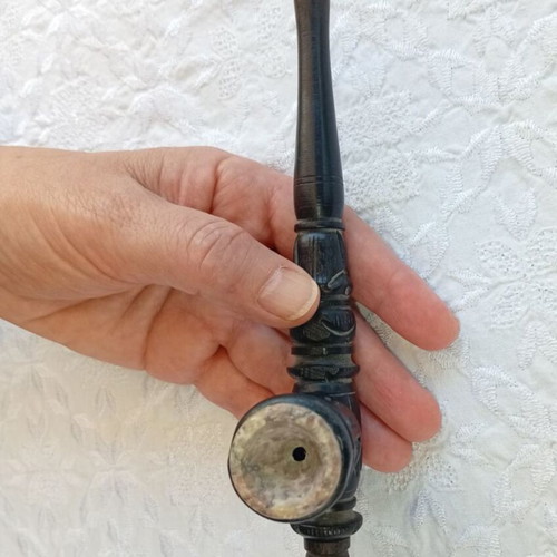 Handmade carved wooden pipe with stone inlay