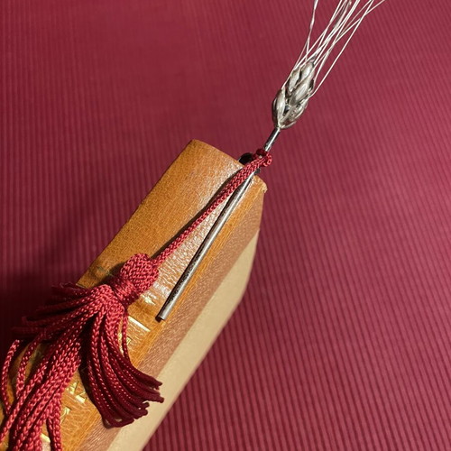 Bookmark with decorative silver ear of wheat and red tassel like new
