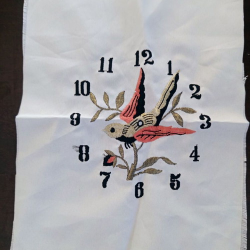 Vintage machine embroidery clock with bird on beige fabric new