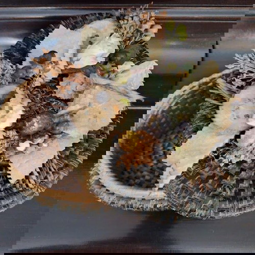 Καλάθι αποθήκευσης σαν καινούργιο με διάκοσμο σε πράσινο οβάλ σχήμα