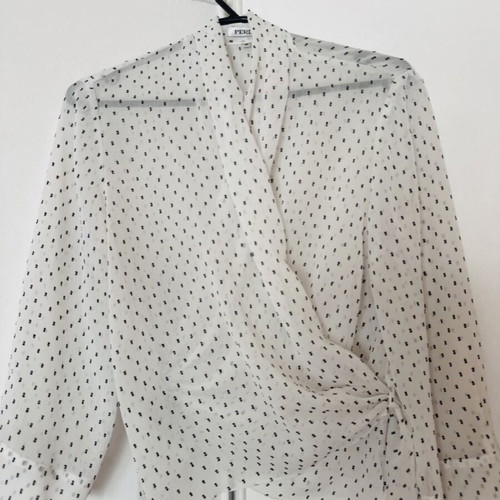 White wrap top with subtle polka dot pattern, like new