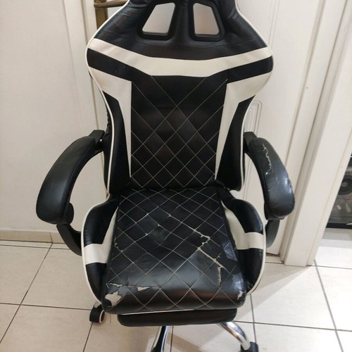 Gaming chair used with footrest made of leatherette