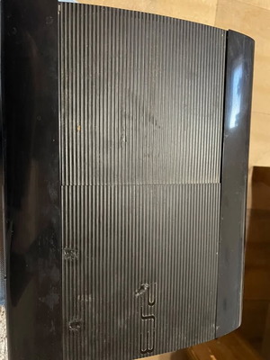 Sony PlayStation 3 slim 500GB like new with games and three controllers