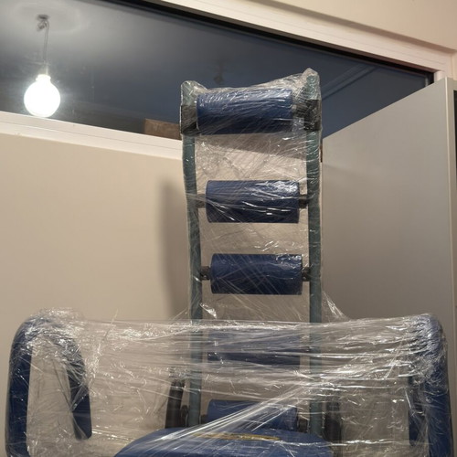 Abdominal Exercise Machine used with soft support cushions and comfortable arms