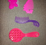 Combs used, missing one tooth on brush, sold separately