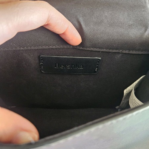 Quilted bag with metal strap like new, black