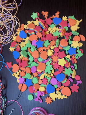 Foam shapes with holes for necklace or garland making, with colorful cords