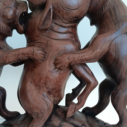 Hunting scene with buffalo and predators wood carving