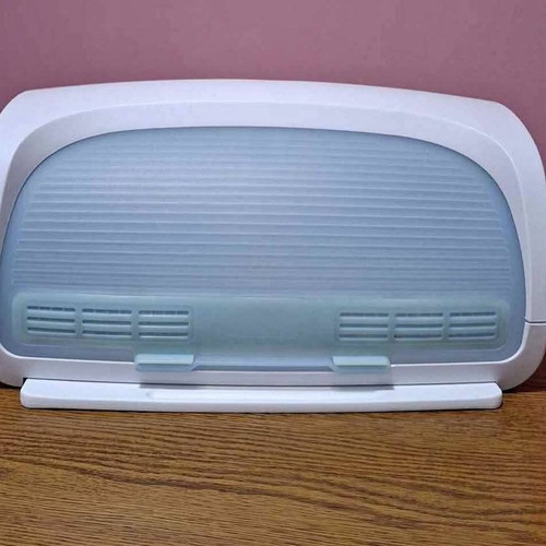 Tupperware bread box new with integrated cutting board