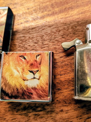 Zippo 2005 used nickel lighter with lion figure