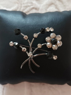 Retro pin made of steel with black and transparent stones like new