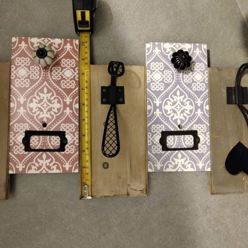 Decorative wall hanger used with wooden base and metal hooks