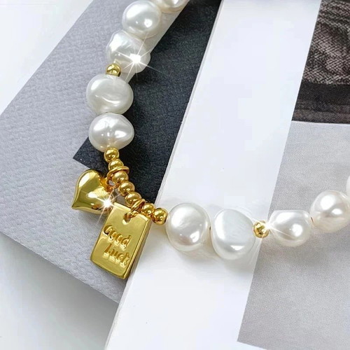 Freshwater Pearl Bracelet with Gold Good Luck Charm