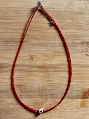 The Secret of Pisces Necklace like new, red