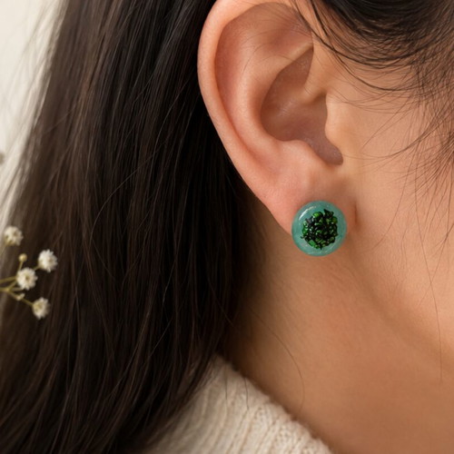 Handmade mint green resin earrings with dark green flakes