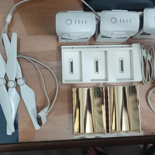 DJI Phantom 4 drone with accessories (no working batteries)