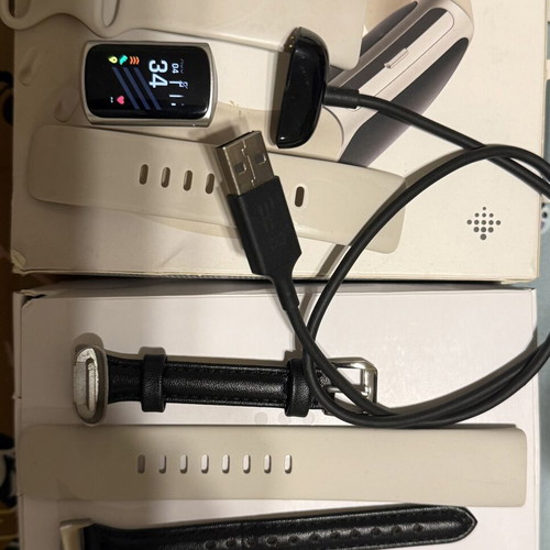 Fitbit Charge 6 smartwatch used with 3 bands and charger