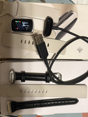 Fitbit Charge 6 smartwatch used with 3 bands and charger